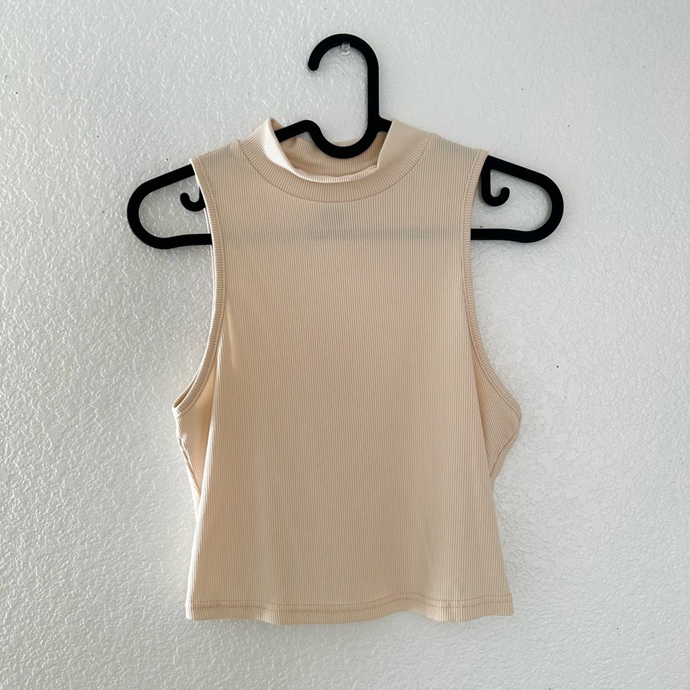 tan cropped shirt